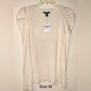 White Sweater with puff shoulders.